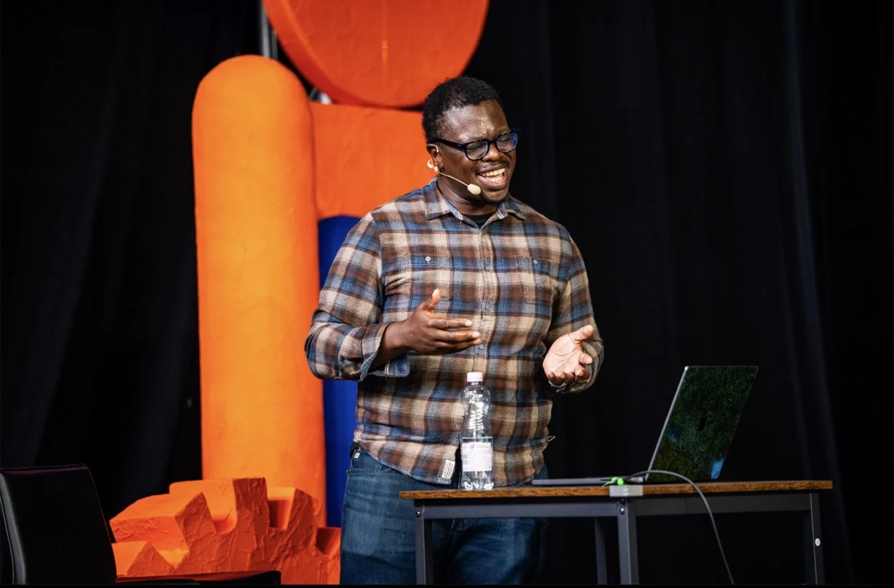 Banjo speaking on stage at Craft Conference